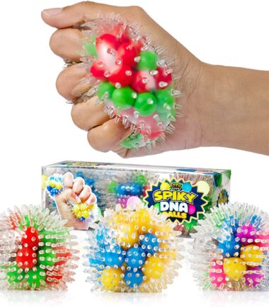 Three Spiky DNA balls at the bottom in different colors and a Spiky DNA ball being squeezed with their packaging at the back.